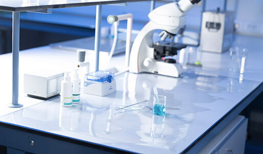 lab mat with chemical liquids and microscope
